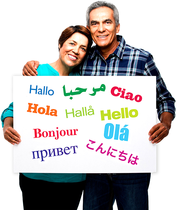 A couple holding a sign with the word hello in different languages