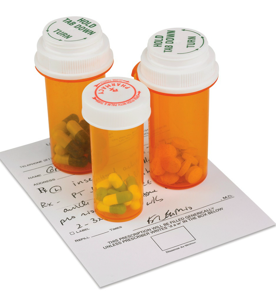 3 prescription pill containers on top of a doctor's prescription