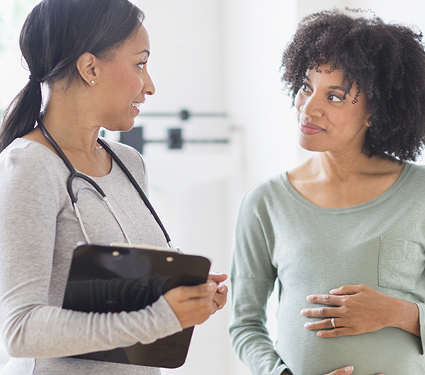 provider talking with pregnant patient