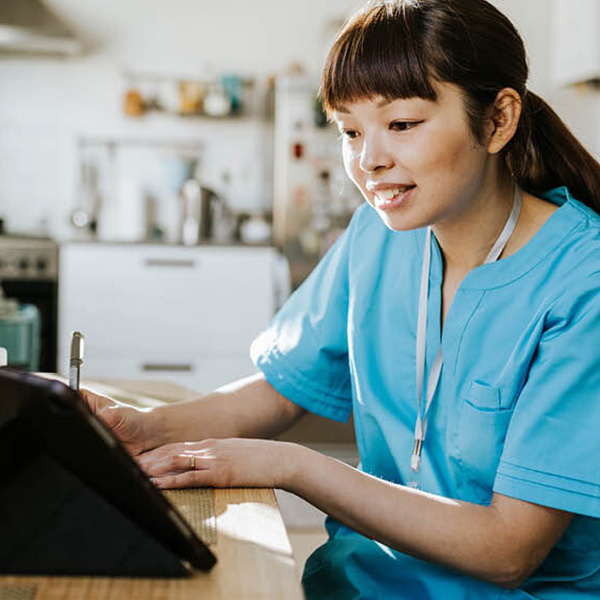 Nurse looking at laptop