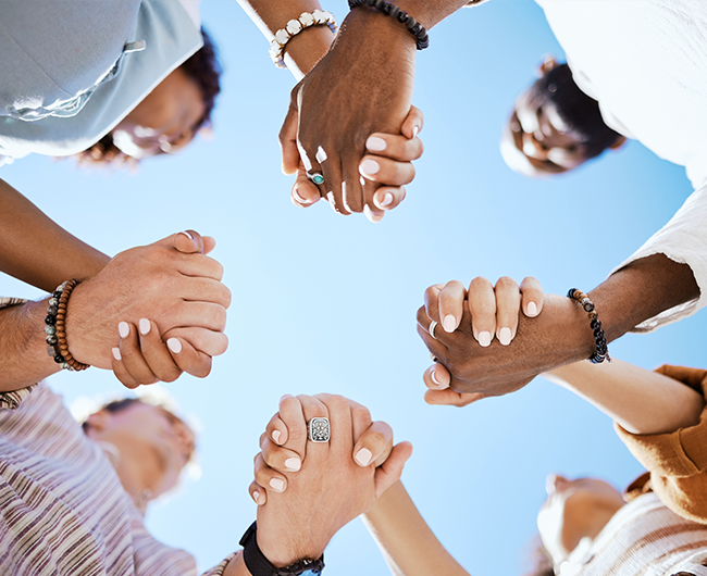 line of people holding hands