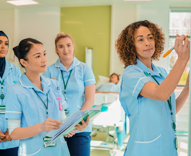 healthcare workers watching instructor