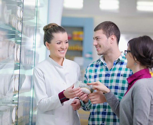 Pharmacist suggesting medical drug to couple