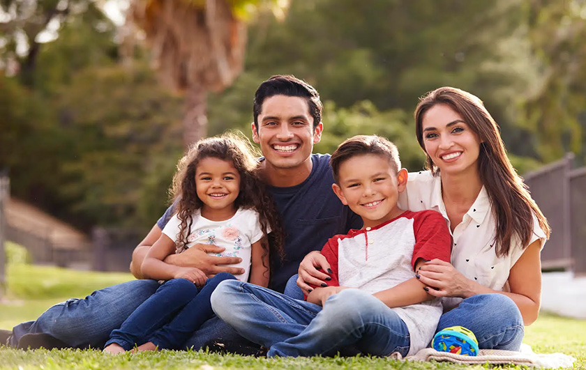 Group photo of parents and children smiling