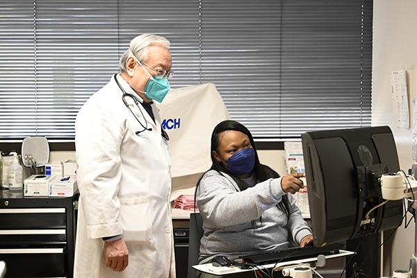 Doctor and assistant looking at a computer monitor