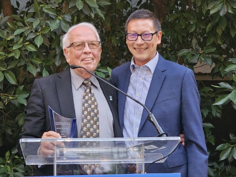 Alex Li, MD, l.A. Care Chief Health Equity Officer, presented Award to John Baackes.