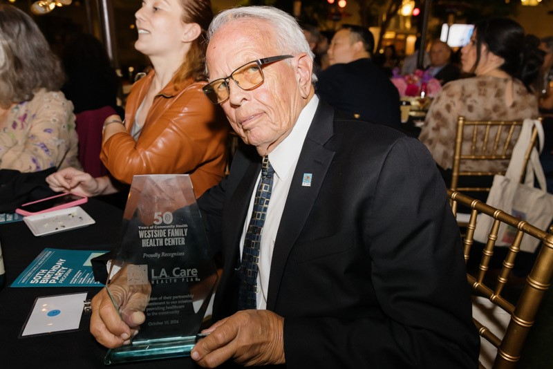 L.A. Care CEO John Baackes with Healthcare Hero Award from Westside Family Health Center