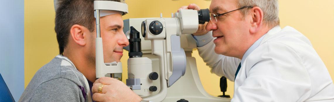 Optometrist giving eye exam
